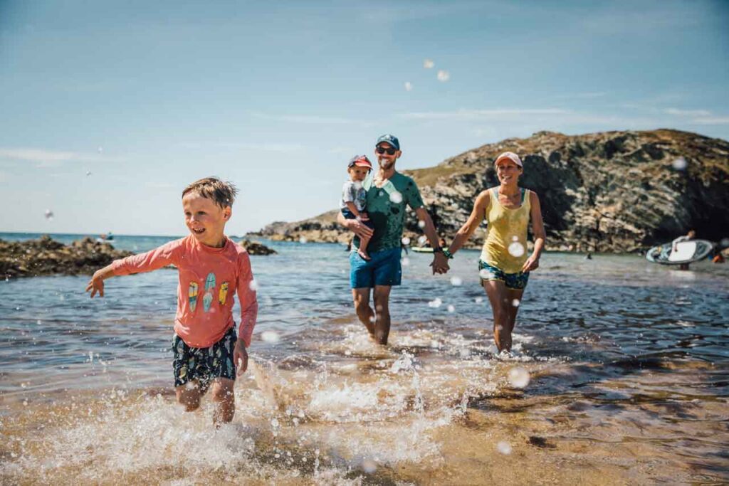 Anglesey Ambassador, family splashing on beach